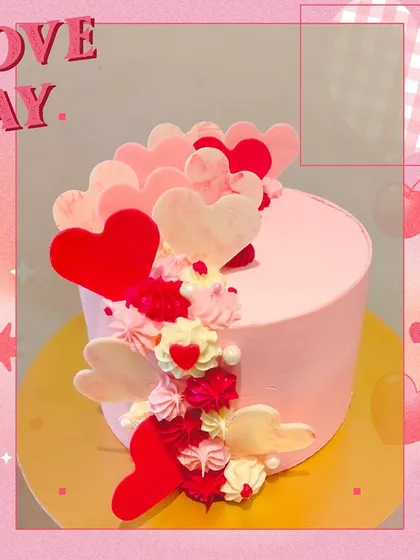 A beautiful and modern cake for your Valentine. This design features a cascade of pink, red, and white chocolate hearts, creating an elegant and romantic look.