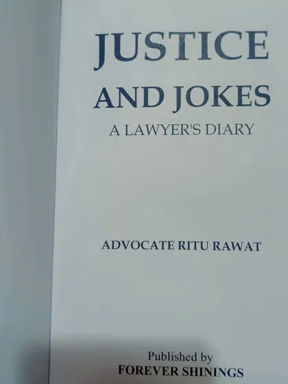 A close-up of the book "Justice and Jokes" by Advocate Ritu Rawat. A must-read for anyone interested in the legal profession.