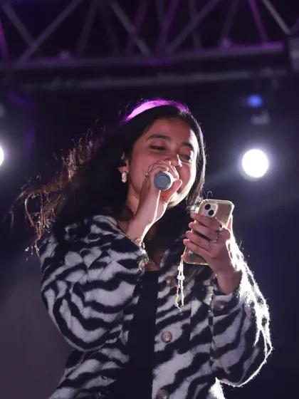 Sometimes you just need to read the lyrics to get them perfect for the crowd. A moment of focus during the RVCE show.