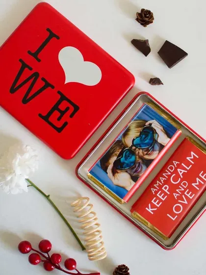 A top-down view of the personalized chocolate tin, a perfect small gift that combines a favorite photo with a sweet treat.