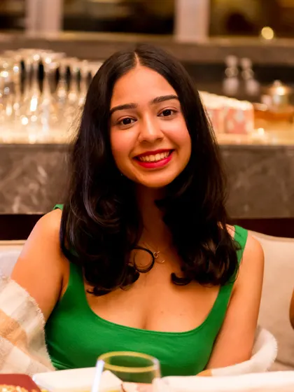 A bright, happy portrait of a guest enjoying the party. We ensure our event photography includes great shots of the guests, as they are an essential part of the memory.