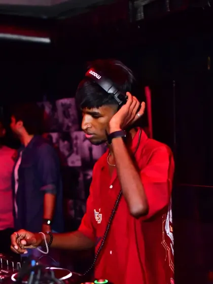A candid shot from behind the decks. Every set is a journey, and I'm locked in, listening to the music and the crowd.