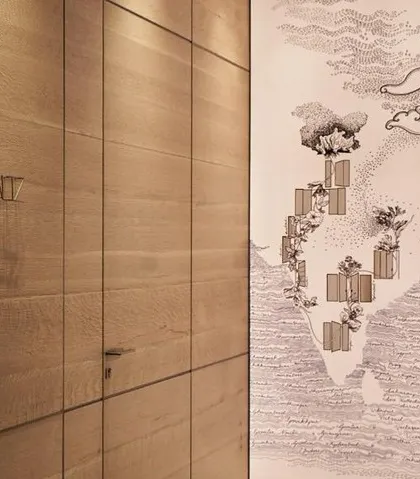 Art and branding are woven into the fabric of our exhibition designs. This custom wall graphic for the WALTZ exhibit adds a layer of artistic storytelling, complementing the clean lines of the wood-paneled door system.