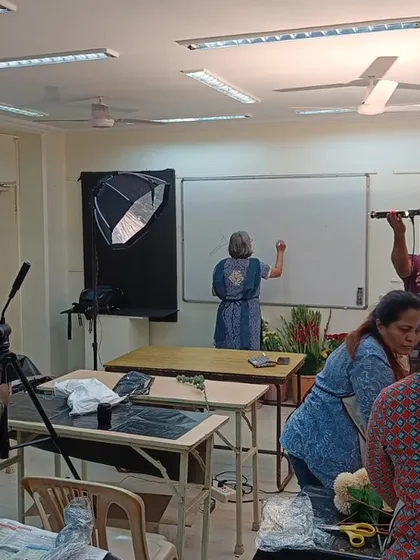 A peek behind the scenes at our institute. This photo shows a class in session being filmed, capturing the dynamic learning environment where our instructors share their knowledge and students bring floral magic to life.