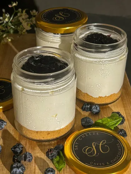 My classic Blueberry Cheesecake jars, ready to be sealed. These are perfect for corporate gifting or as a special treat, featuring our signature logo on the lid.
