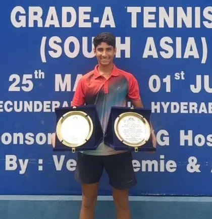 Tavish Pahwa holding his singles and doubles trophies after winning the double crown at the Under 14 Asian Grade A event in Hyderabad, a top-tier national event.