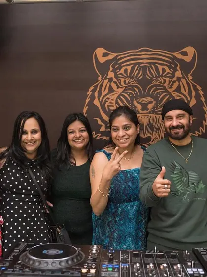 Posing with some fans at the DJ booth at Badmaash.