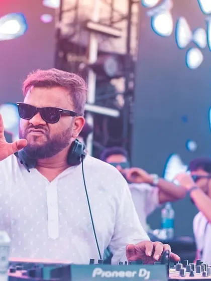 Another shot of me at the decks during a Holi festival, looking focused and ready to drop the next beat.