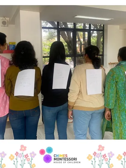 A trust-building exercise where teachers write positive affirmations on each other's backs.