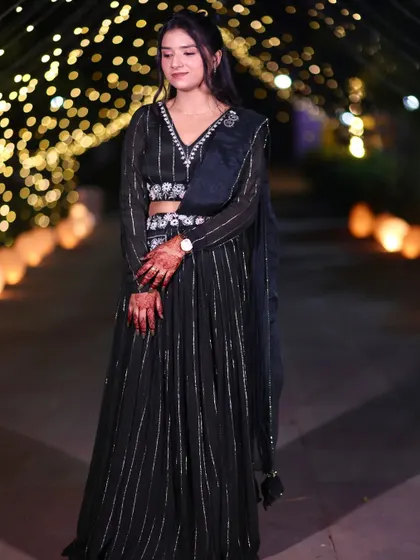 A full shot of this elegant party look. The background with the bokeh lights adds to the festive mood.