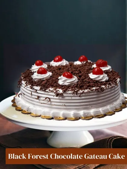 My take on the classic Black Forest Chocolate Gateau. This cake features layers of chocolate sponge, fresh cream, and cherries, topped with chocolate shavings for a timeless and beloved dessert experience.