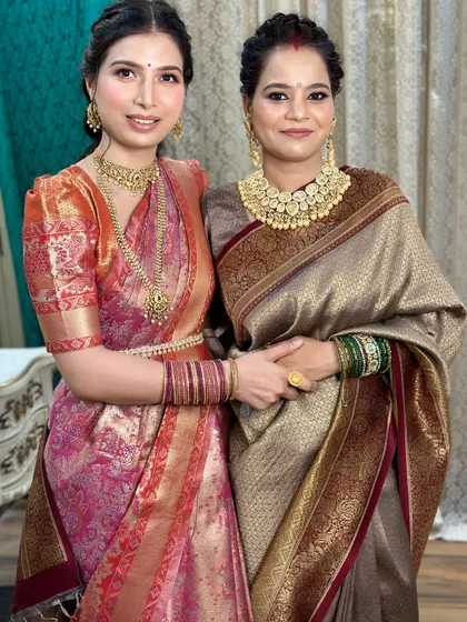 Another beautiful portrait of the sisters. Their makeup is coordinated but tailored to their individual features.