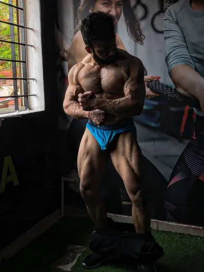 A shot of my physique four weeks out from a competition, showing the conditioning and fullness we aim for in the final stages of prep.