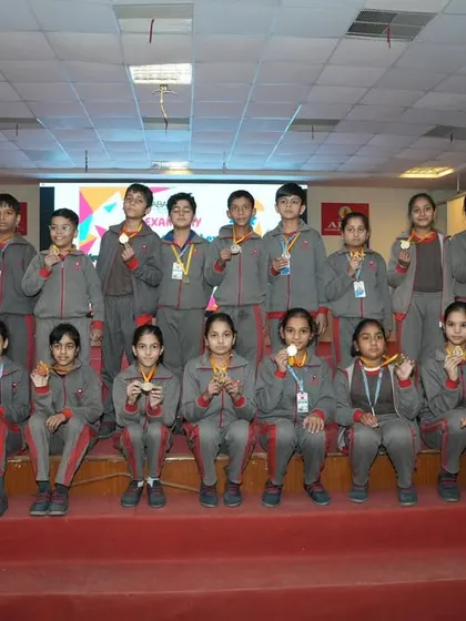 A proud moment for these students as they pose with their medals on stage. Competing and winning builds immense confidence and a sense of accomplishment.