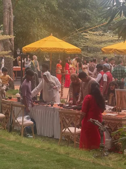 A wide view of my block printing station at a wedding. It always becomes a popular gathering spot, drawing in guests who are curious to watch and excited to try creating something with their own hands.
