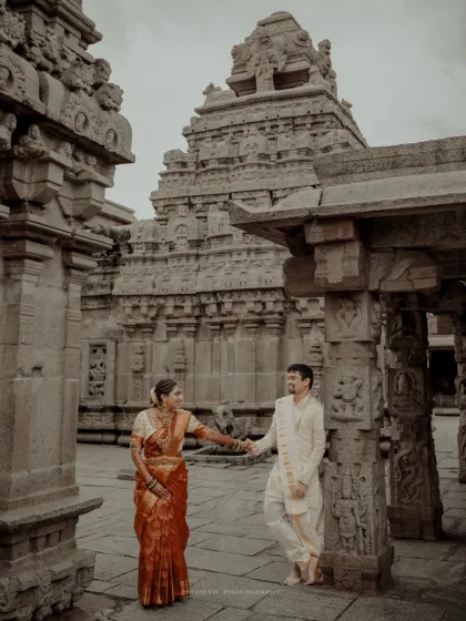 Hand in hand amidst the ancient stone pillars of Bhoganandishwara Temple. This pre-wedding shoot blends love with cultural heritage.