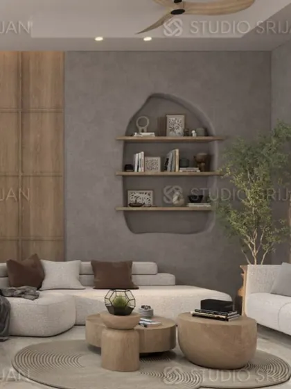 A cozy corner in the Greenwood City project, with a curved sofa and a unique recessed wall-shelf that adds character and display space.