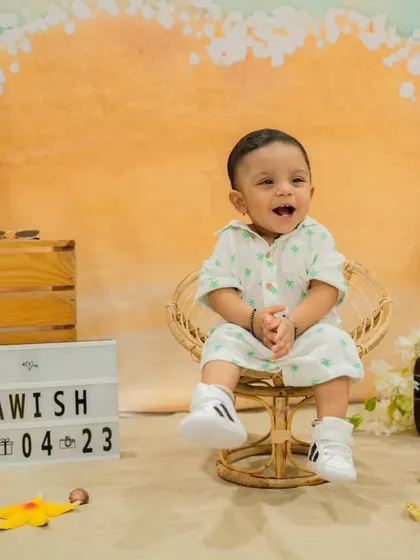A happy, clapping moment from the studio beach session. His joyful expression is what it's all about.