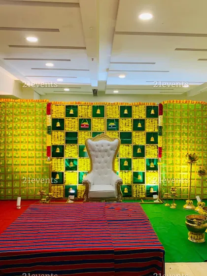 Another view of our green and yellow bell-themed backdrop. The wide shot shows how the side panels extend the design, creating a grand and immersive stage for your event.