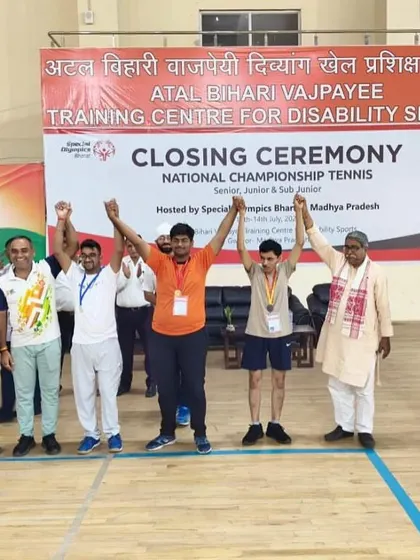 A moment of victory at the closing ceremony of the National Championship Tennis event. Our player stands with officials and fellow competitors, representing the spirit of sportsmanship we instill at ILTA.