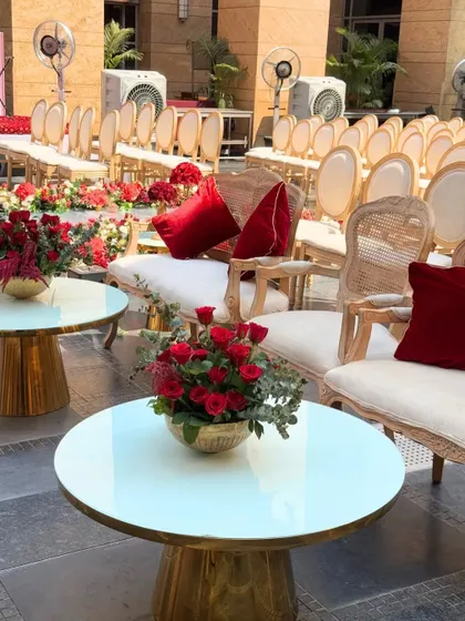 A lounge dipped in comfort and crimson charm. I create stylish and comfortable seating areas for guests to relax and mingle in royal style.