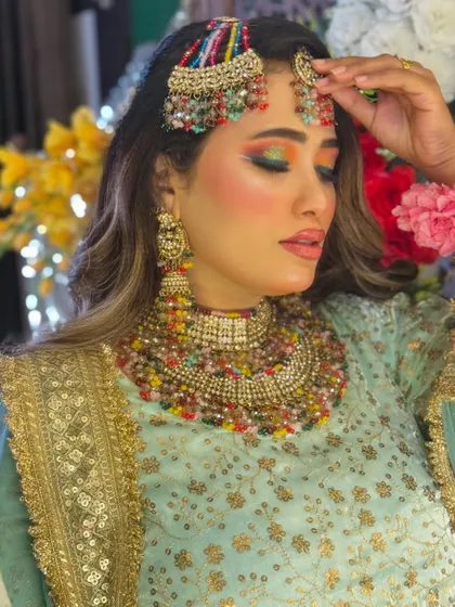 A final look at this beautiful Haldi bride. The colorful eyeshadow and glowing skin make her look absolutely stunning and ready for her ceremony.