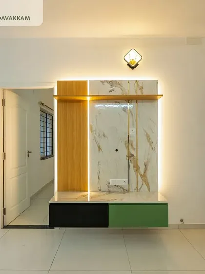 A minimalist floating TV unit from our Casagrand Zenith project, combining wood, marble, and color-blocked laminates with profile lighting for a sleek and modern look.
