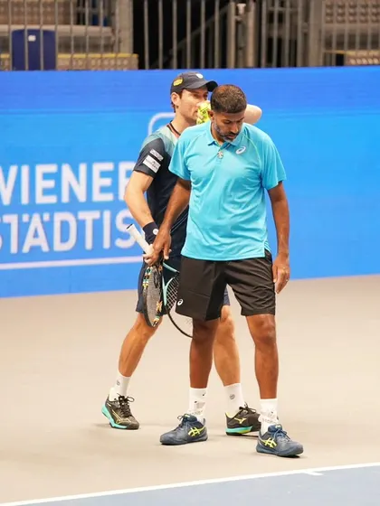 A moment of support between partners after a tough point.
