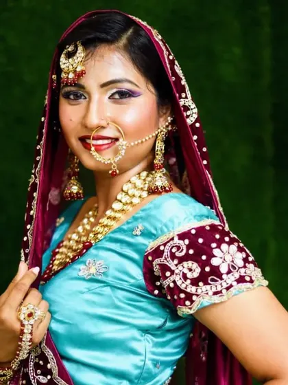 A smiling bride in her full Muslim wedding attire. My course covers the specific techniques and cultural nuances of different types of bridal makeup.