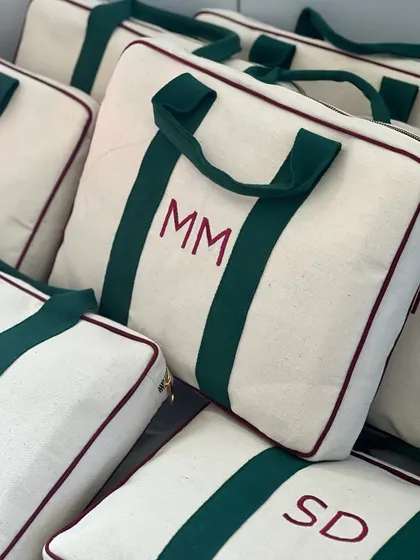 Personalized canvas bags with embroidered initials, created for a corporate Women's Day order for Adani Connex. A stylish and useful gift to celebrate the women on your team.