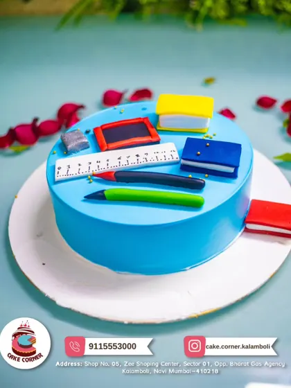 A cake for the studious one, decorated with edible books, pens, and a ruler. A fun and creative cake for a student or teacher.