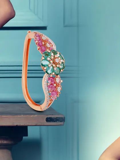 Threads of rose gold entwine with the brilliance of diamonds and colorful gemstones to craft a masterpiece. This kada is a statement of artistry and grace.