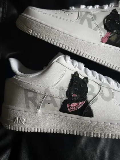 A detailed close-up of the Rambo portrait, showing him wearing a pink bandana.