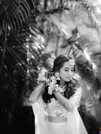 A beautiful black and white portrait that highlights the texture and shape of our floral haath phool.