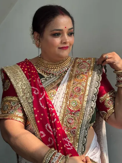 A beautiful portrait of the bride in her traditional attire. The makeup is subtle yet defining, ensuring she looks perfect from every angle.