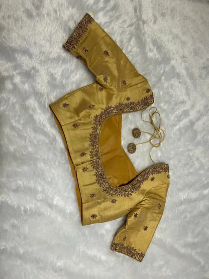 Because basic isn’t in our vocabulary. All-over gold handwork, crafted to make you the main event.
