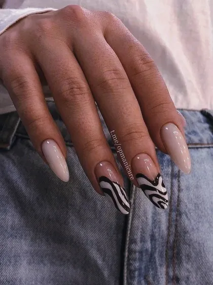 A cool, abstract take on animal print with these black and white zebra-inspired swirls on a neutral base.
