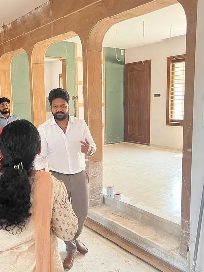 A picture of me explaining the design plan to clients during a site visit, showcasing my hands-on and collaborative approach.