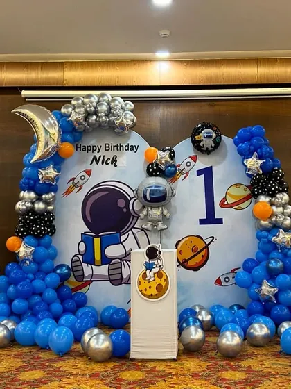 This image captures the entire space-themed setup, perfect for a little astronaut's first birthday adventure.