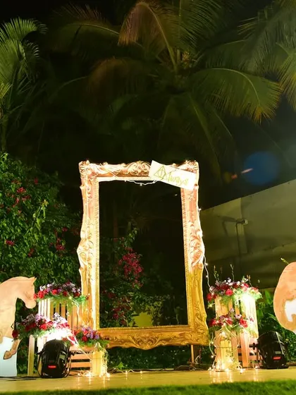 Another fun photo booth with a large frame and animal cutouts, perfect for an outdoor event with a rustic or jungle theme.