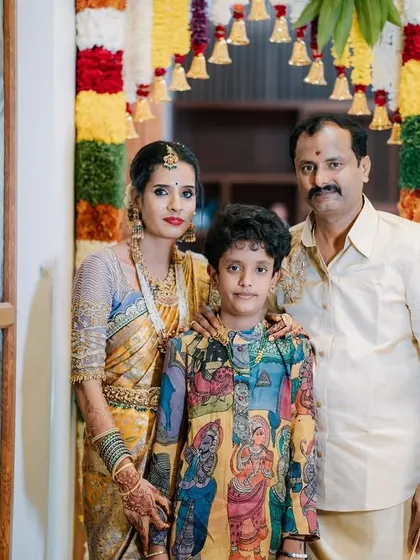 This look celebrates family and tradition. My client Archana's son shines in a custom-made, hand-painted Pen Kalamkari kurta, a piece of wearable art that beautifully complements his mother's traditional saree.