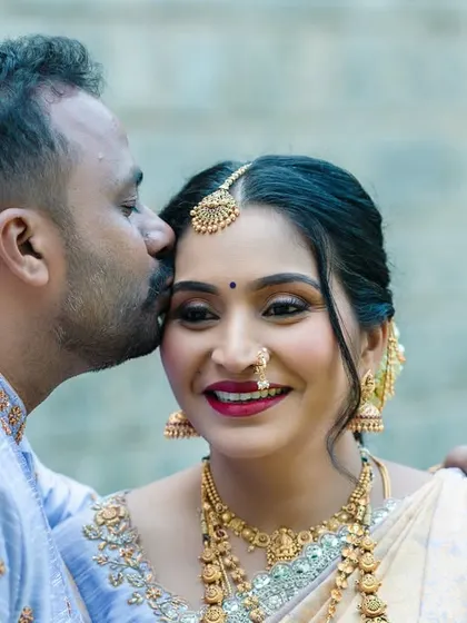 A close-up portrait filled with affection. This shot focuses on the tender connection between the couple during their traditional maternity photoshoot.