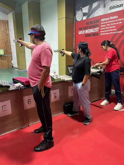 Our pistol shooters practicing their aim at the range. We offer coaching across multiple Olympic disciplines, including 10m Air Pistol.