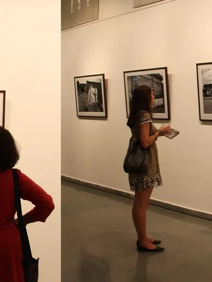 Visitors at my debut solo show, 'Face two Face' (2012). This exhibition was a major milestone, exploring identity through black and white street photography and staged portraits.