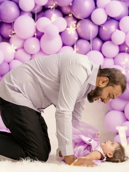A tender moment between a father and his baby girl. These candid interactions are what make family photoshoots so special.