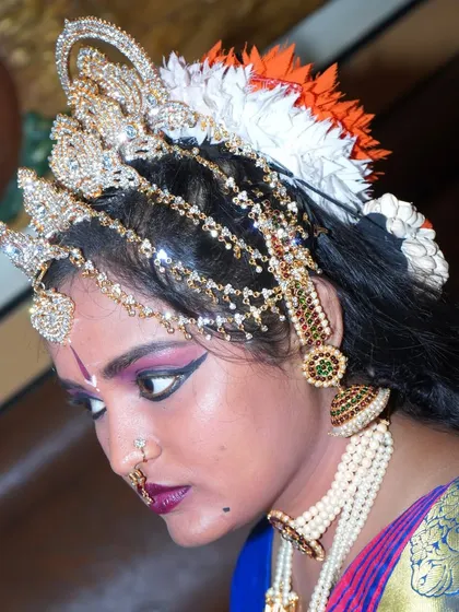 A contemplative profile shot, capturing the dancer in a moment of focus and artistry.