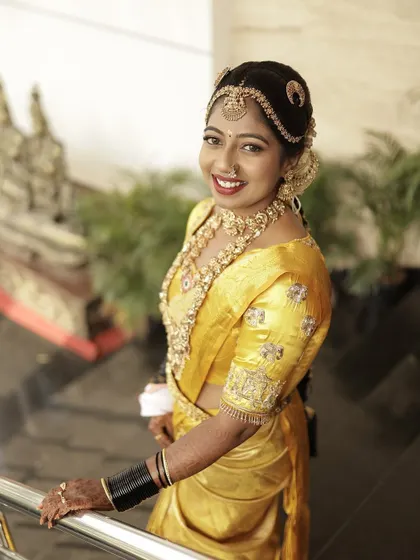 The bride looking elegant and poised, her custom blouse adding the perfect finishing touch to her bridal attire.