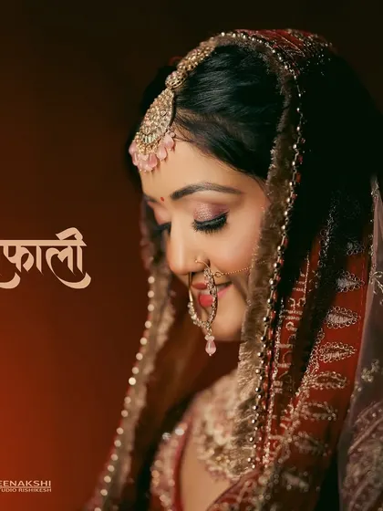 A simple yet stunning bridal portrait with her name, "Shefali," written in elegant Devanagari script. This adds a beautiful, personalized touch to her photo.