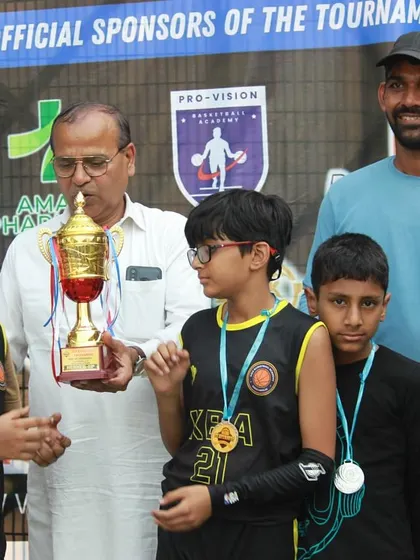 Receiving the trophy with the Under-12 team. I always say, winning is a habit, not a fluke, and these kids are learning that early.