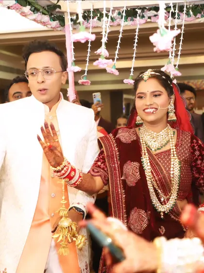 The bride's grand entrance with her groom, her happiness shining through.